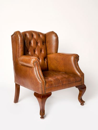 Fauteuil à oreille de style George I
Réplique...