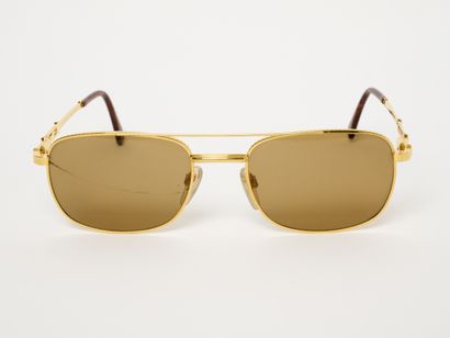 GERALD GENTA 
Rare lunettes de soleil dorée...