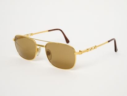 GERALD GENTA 
Rare lunettes de soleil dorée...
