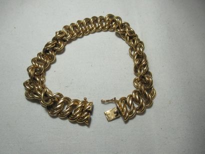 Bracelet en or 18K (tête d'aigle). Poids...