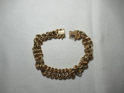 Bracelet en or 18K (tête d'aigle). Poids...