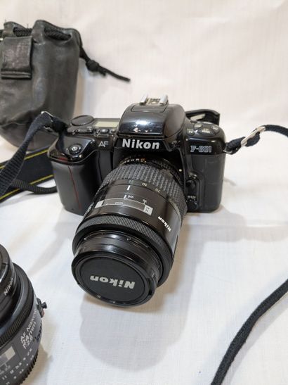 NIKON. Set of two cameras—one D70s and one...