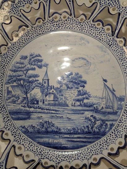 White and blue earthenware fruit basket decorated...