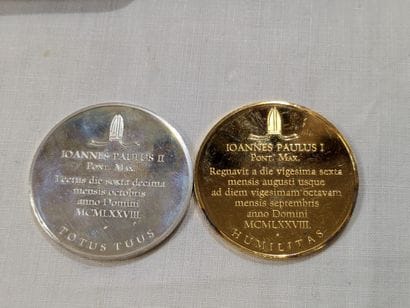 Set of two medals: one in vermeil, featuring...