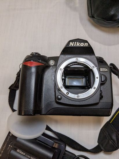 NIKON. Set of two cameras—one D70s and one...