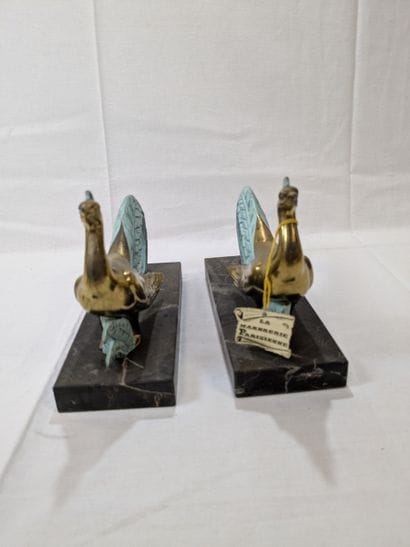 Pair of metal figurines depicting peacocks....