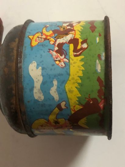 Vintage toy from the 1920s–1940s, a hand-cranked...