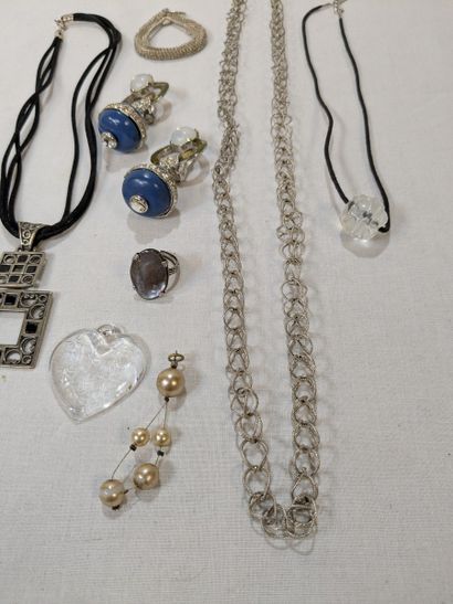Set made of metal, resin, and glass, including...