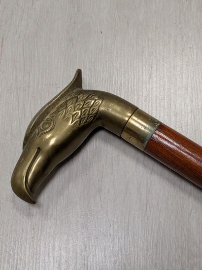 Wood and brass cane with an eagle-head-shaped...