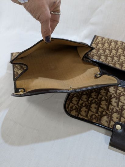 DIOR Lot de deux pochettes en toile monogrammée....