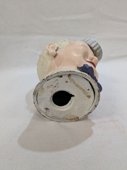 COCA-COLA. A painted cast-iron piggy bank...