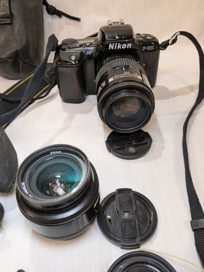 NIKON. Set of two cameras—one D70s and one...