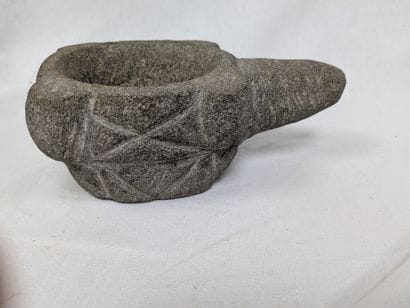 Stone mortar with engraved decoration. 6x14...