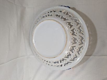 White and blue earthenware fruit basket decorated...