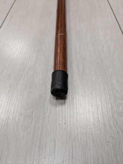 Wood and brass cane with an eagle-head-shaped...