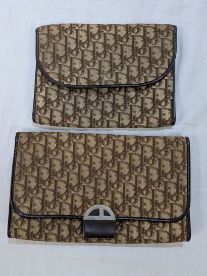 DIOR Lot de deux pochettes en toile monogrammée....