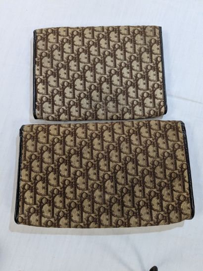DIOR Lot de deux pochettes en toile monogrammée....