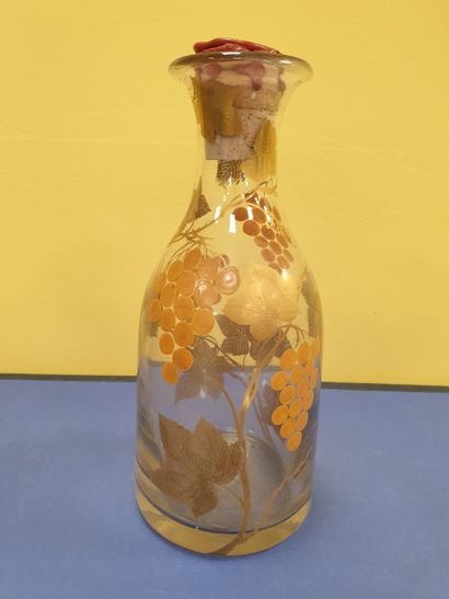 A decanter decorated with vine motifs
With...
