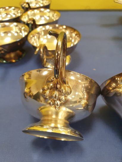 A set of 8 tastevins and 8 dishes with their...