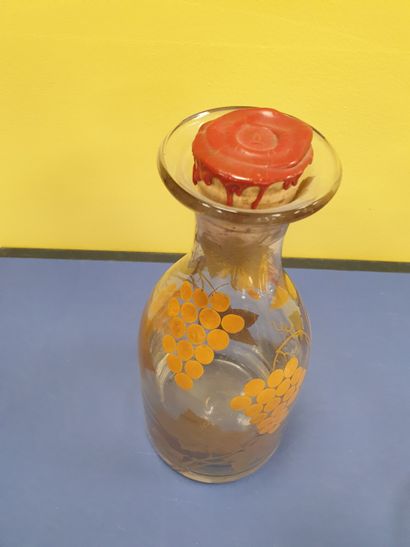 A decanter decorated with vine motifs
With...