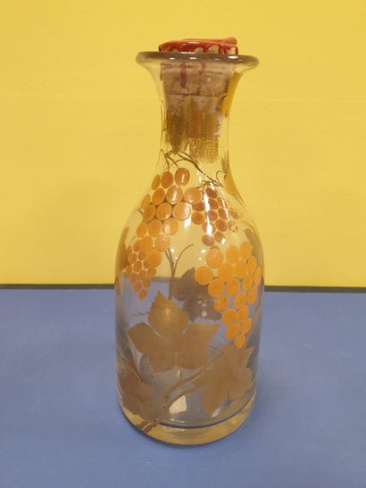 A decanter decorated with vine motifs
With...