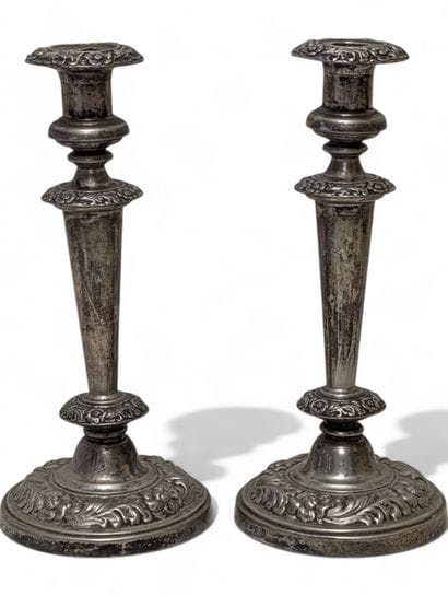 Pair of silver sheet torches, repoussé-worked...