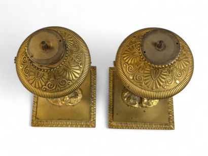 A pair of chased ormolu table candlesticks...