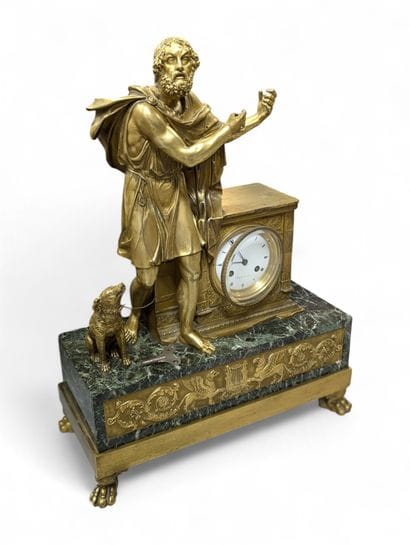 Gilt bronze terminal clock flanked by the...