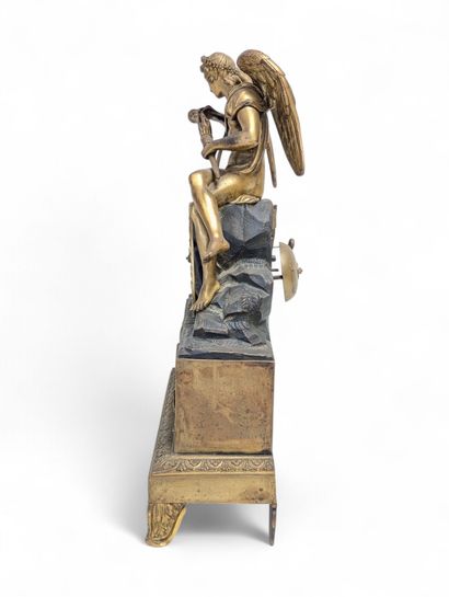 Chased and gilded bronze terminal clock surmounted...