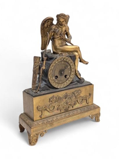 Chased and gilded bronze terminal clock surmounted...