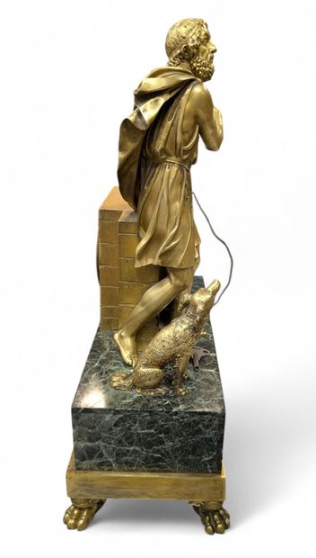 Gilt bronze terminal clock flanked by the...