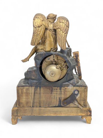 Chased and gilded bronze terminal clock surmounted...
