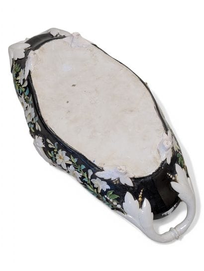 A large polychrome porcelain jardinière with...
