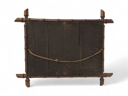Miroir cadre en bambou sculpté à décor d'écoinçons...