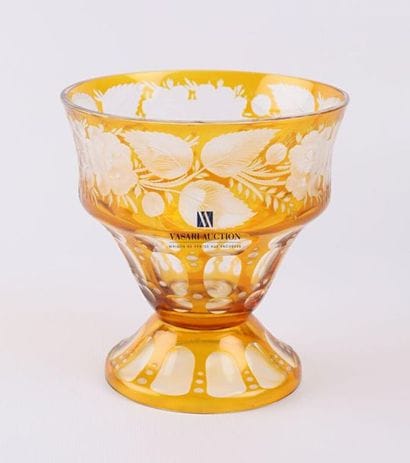 A bohemian ochre crystal bowl, it rests on...