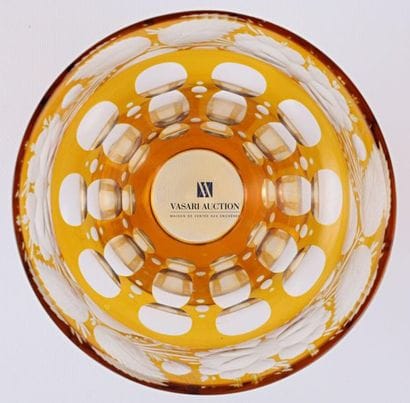 A bohemian ochre crystal bowl, it rests on...