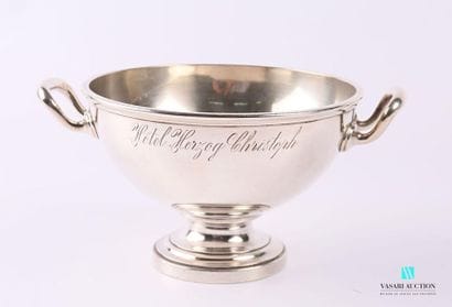 Salad bowl in silvery metal resting on a...