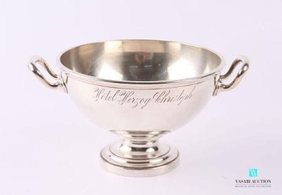 Salad bowl in silvery metal resting on a...