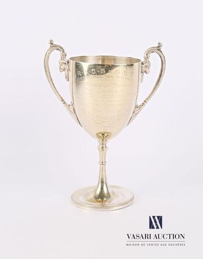 A silver-plated metal bowl resting on a pedestal...