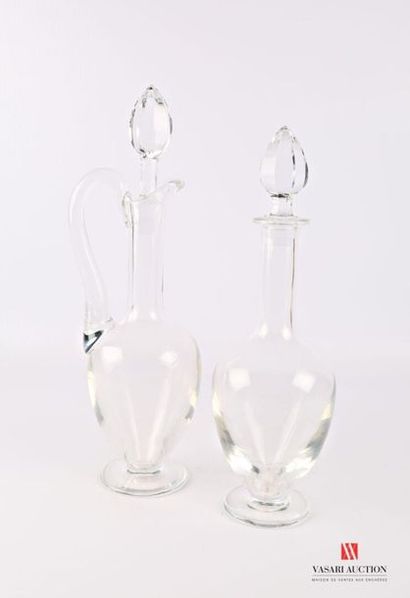 Two crystal carafes resting on a pedestal...