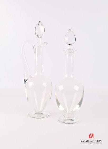 Two crystal carafes resting on a pedestal...