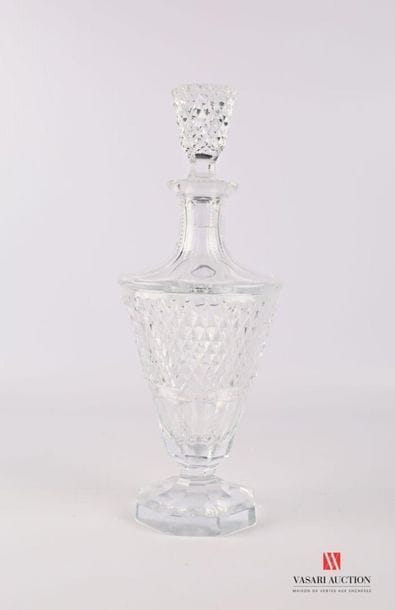 Moulded crystal decanter resting on an octagonal...
