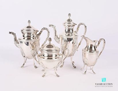 Tea and coffee service in silvery metal resting...
