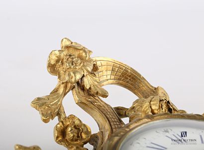 Gilded bronze applique cartel, the white...