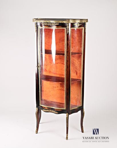 Natural wood and veneer showcase, it is topped...