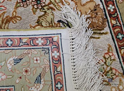 Pair of silk carpets decorated in its center...