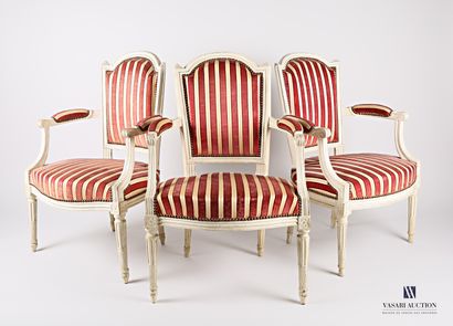 A suite of three moulded wooden armchairs,...