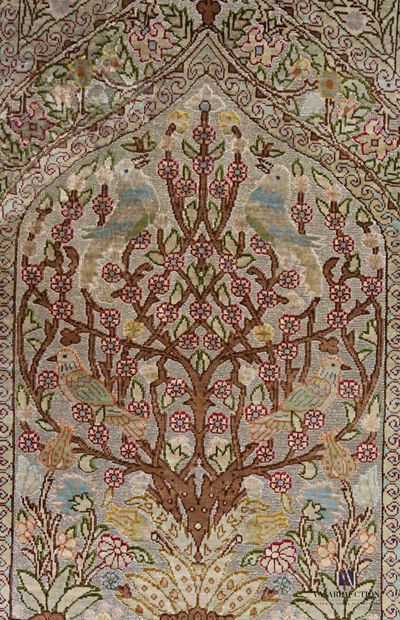 Small silk carpet decorated in the centre...