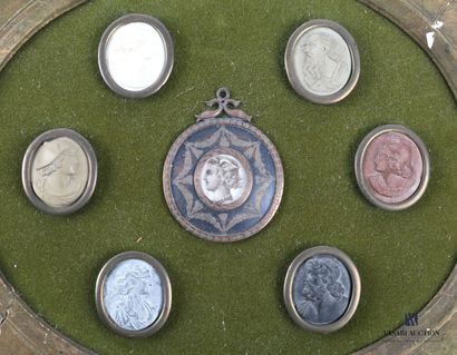 Medallion frame with a winged head profile...