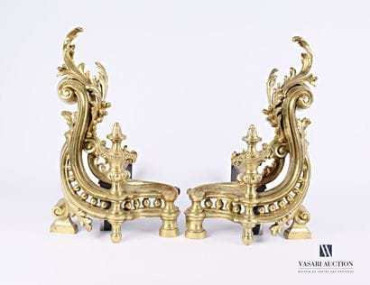 Pair of bronze andirons presenting a baluster-shaped...